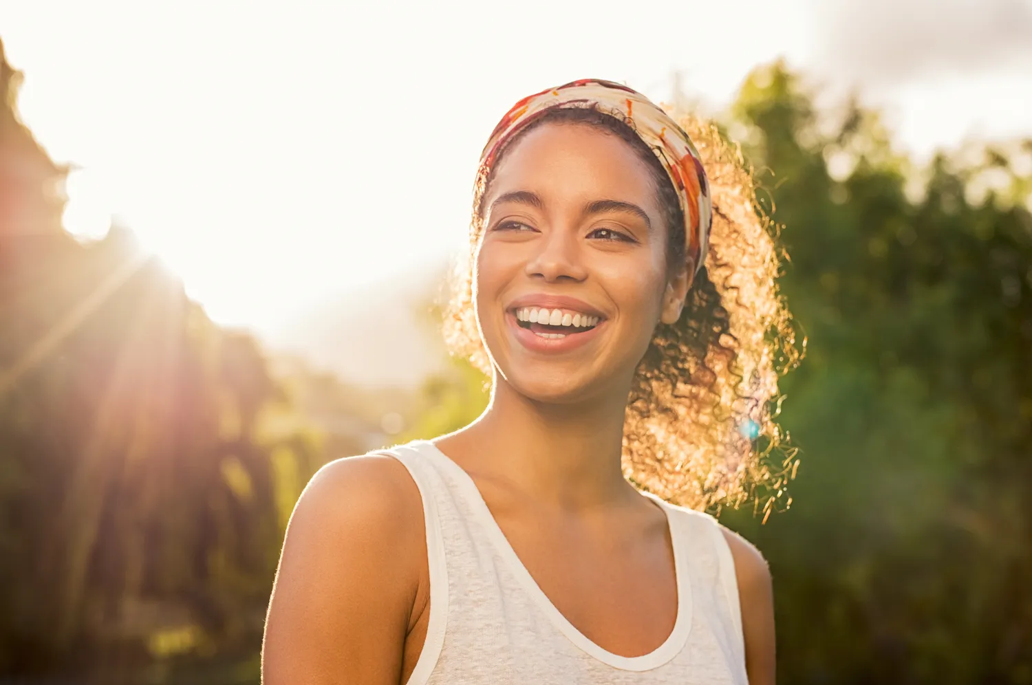 Beautiful young woman smiling outdoors